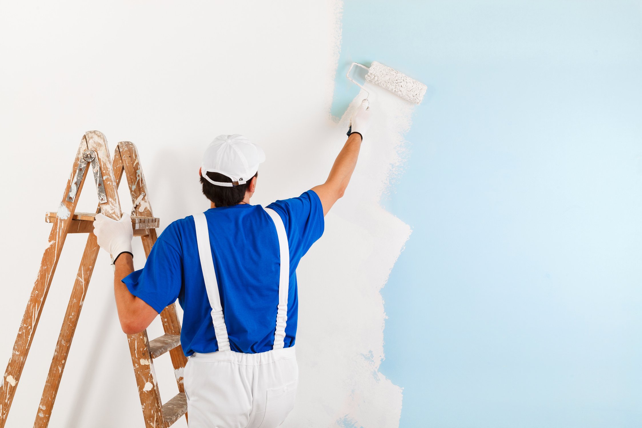 painter painting with paint roller